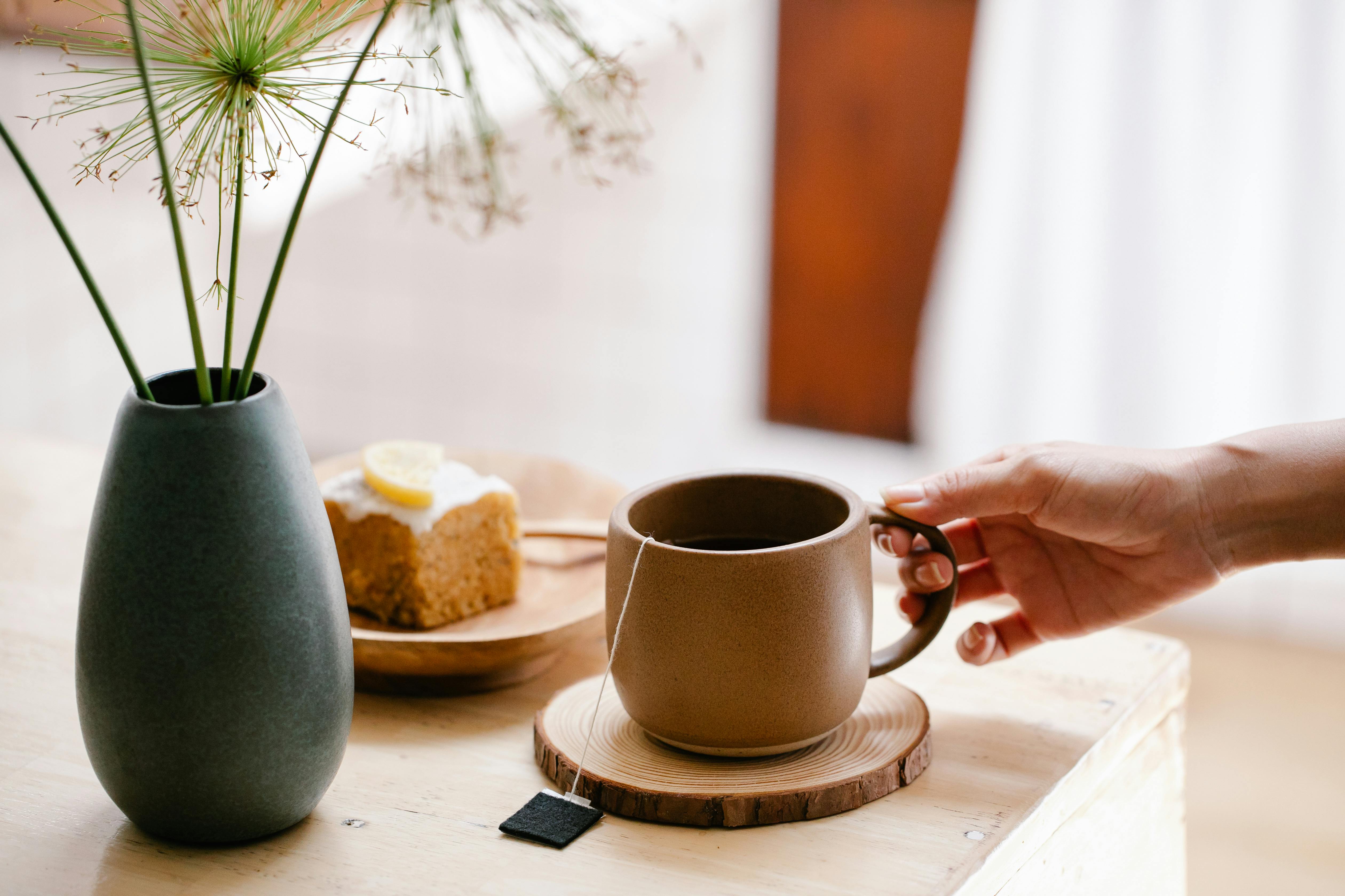 Photo of Handgun Near Mug · Free Stock Photo