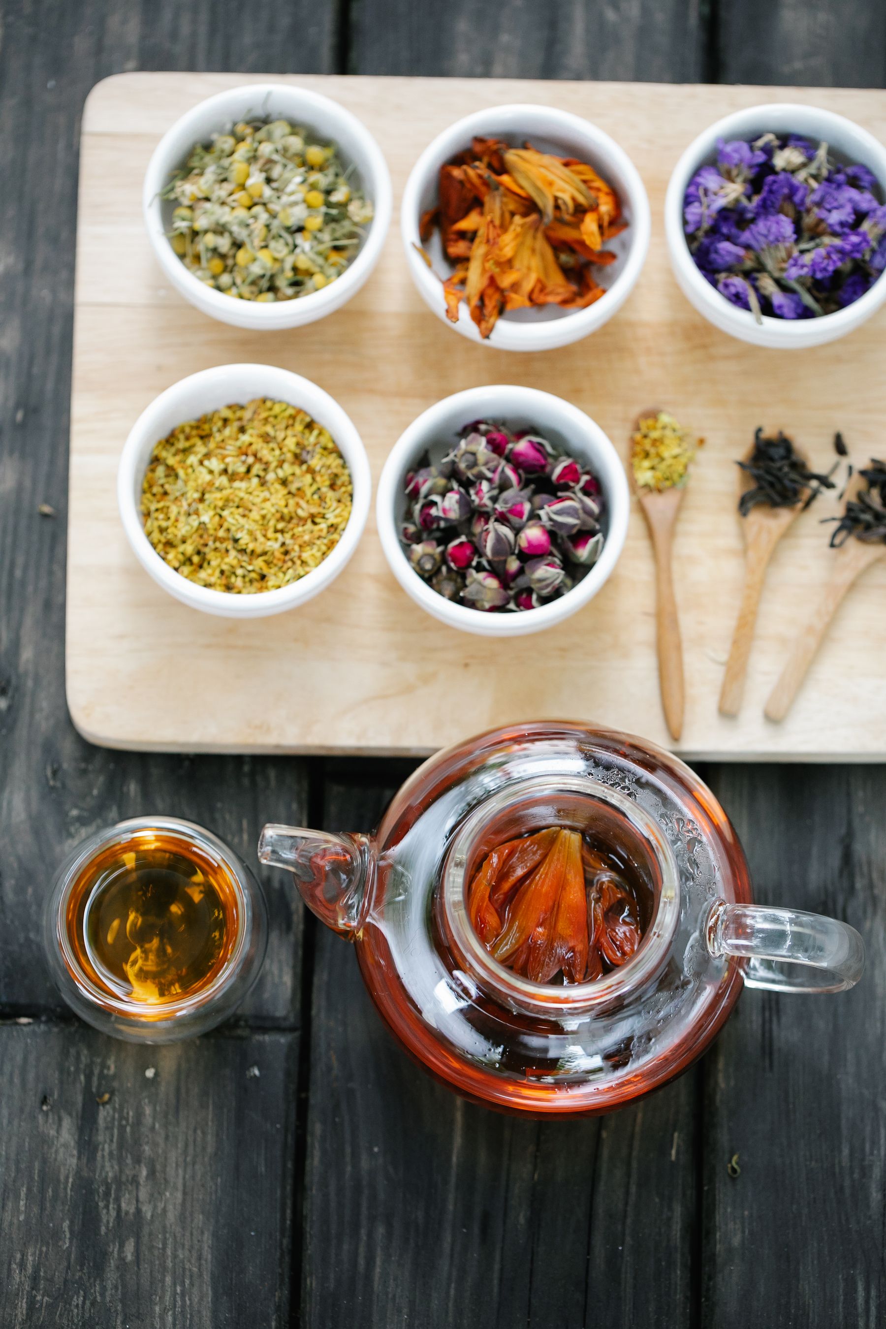 Dried herbs and flowers arranged in bowls Dried herbs and flowers arranged in bowls