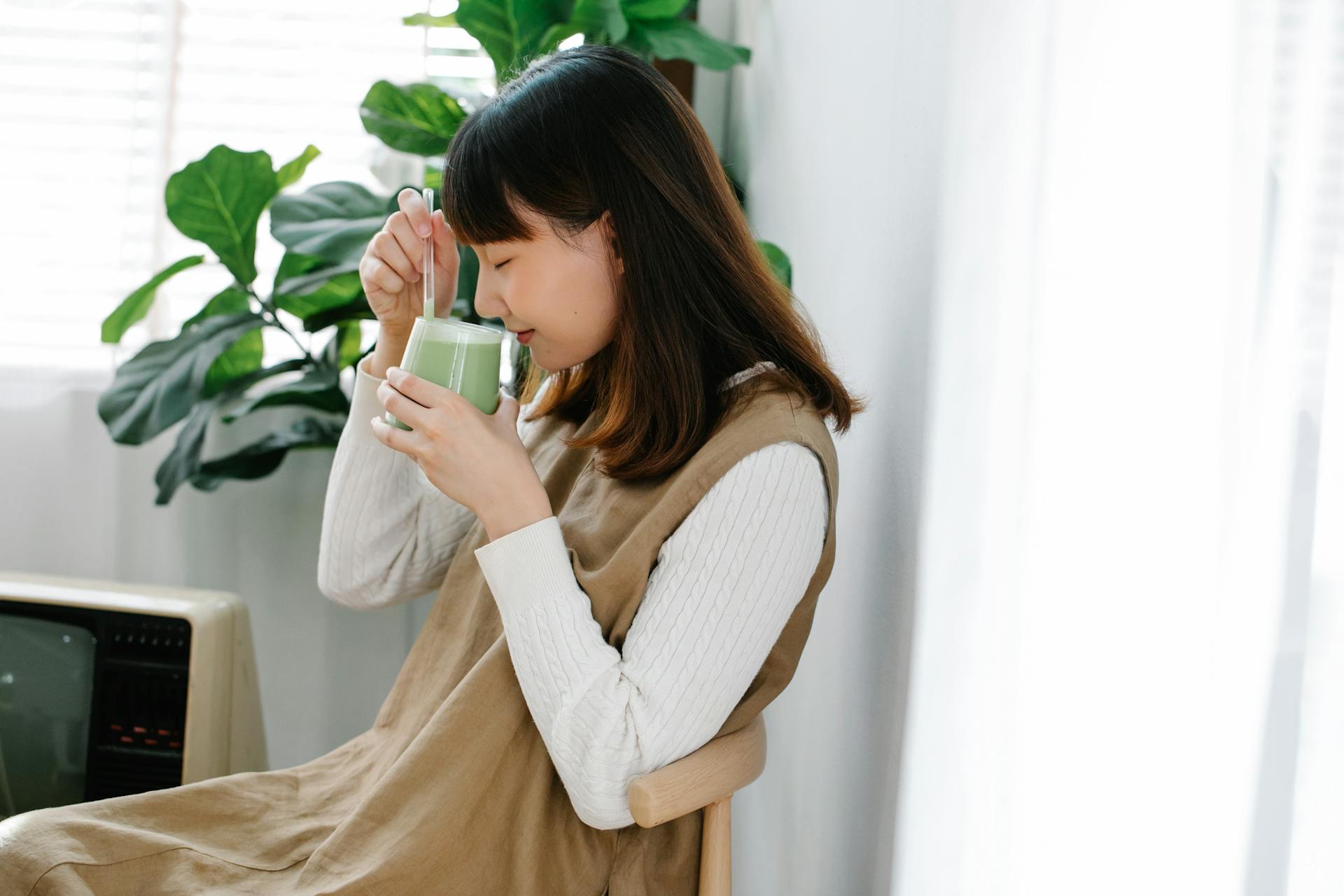 Woman Smelling her Drink