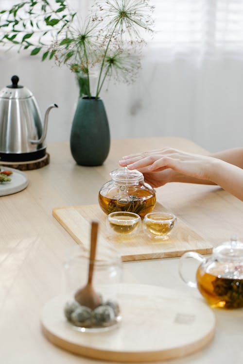 Free Person Drinking Tea at Table Stock Photo