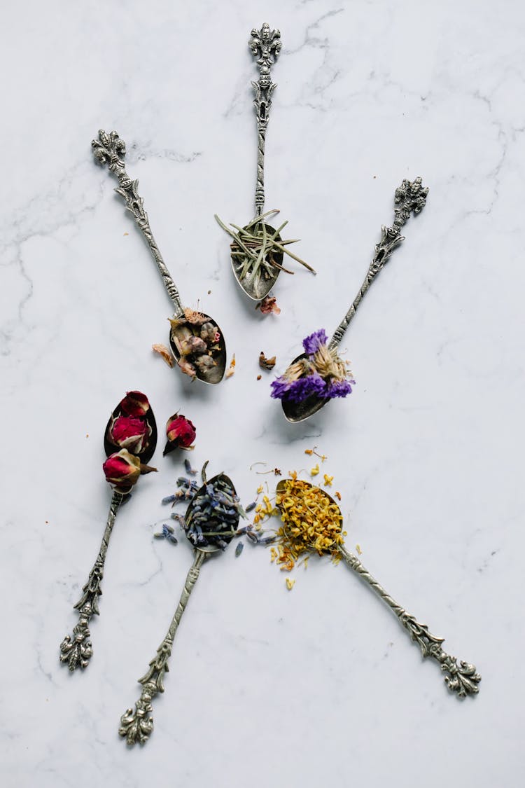 Colorful Herbs On Teaspoons