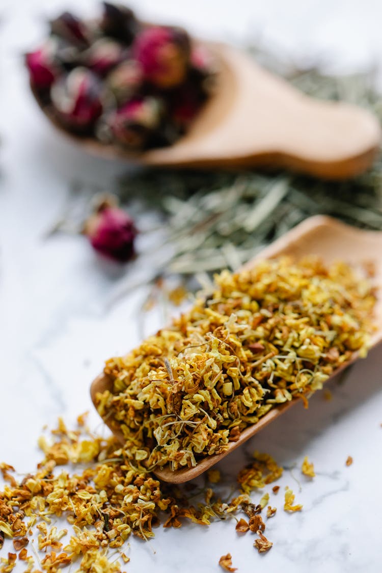 Close-up Of Tea In Wooden Spoon