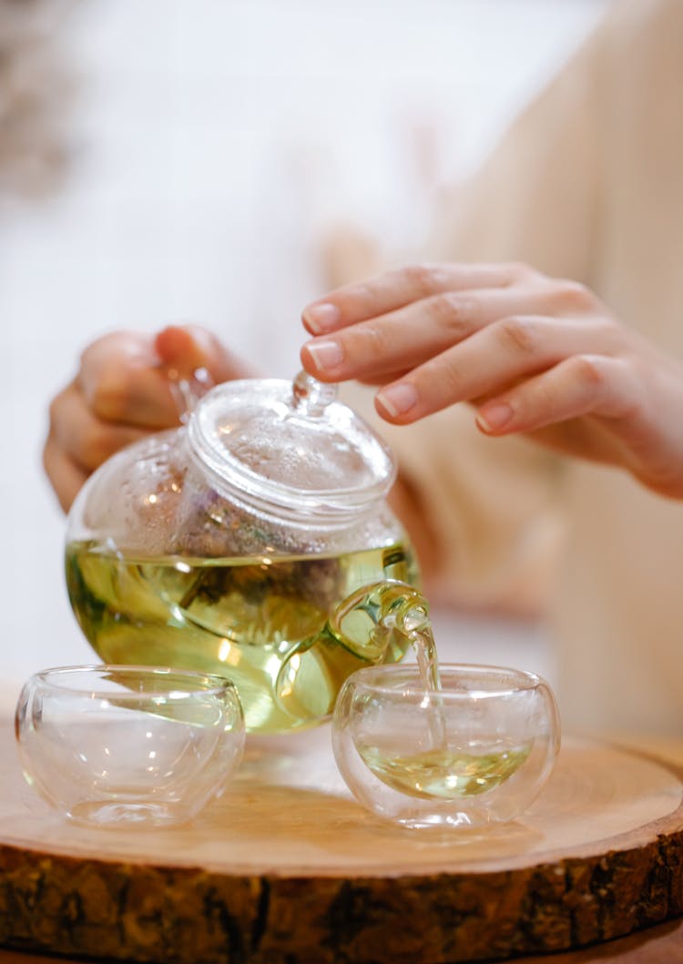 Person Pouring Tea 