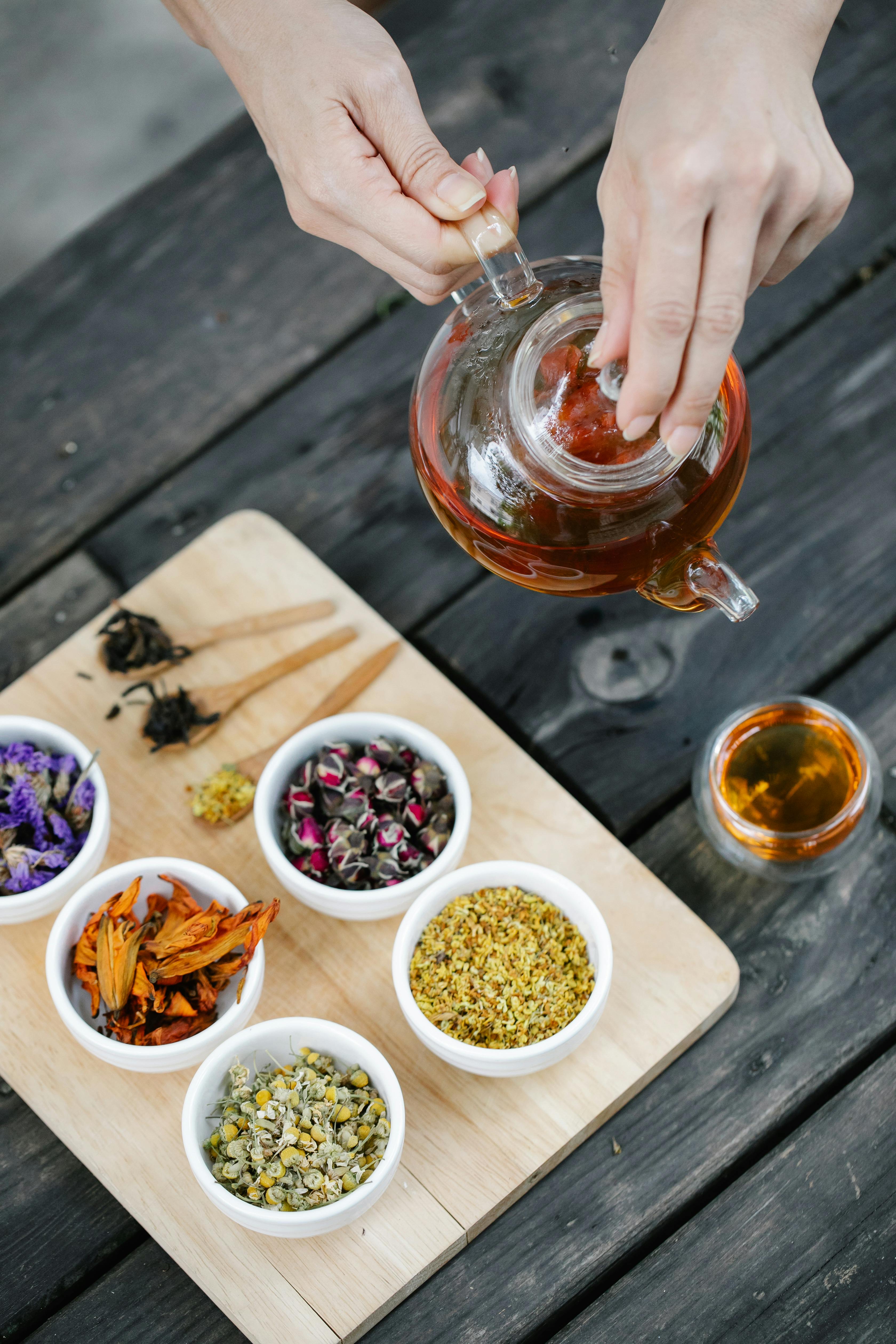 assorted herbs on wooden chopping board