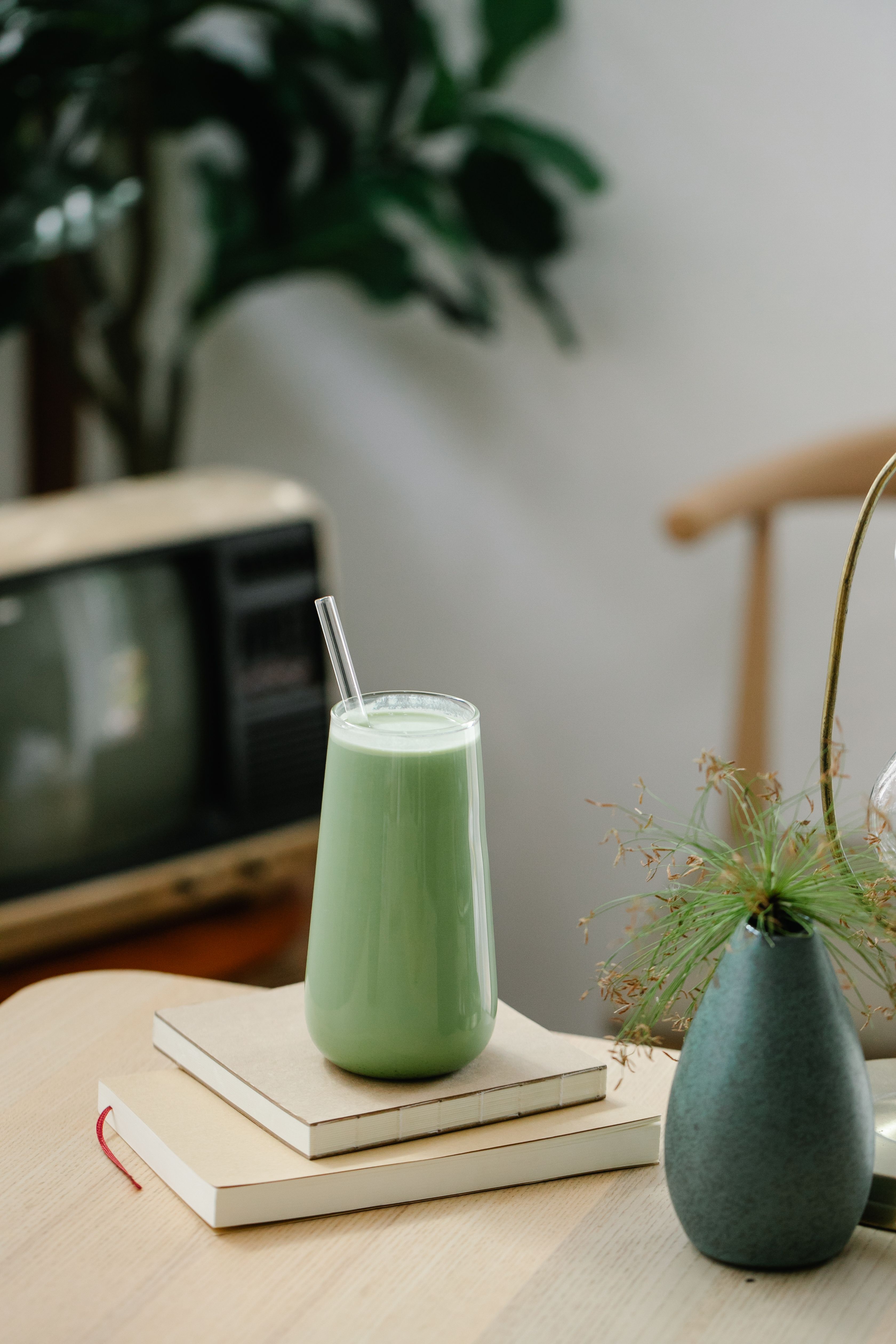 Making matcha latte with bamboo whisk