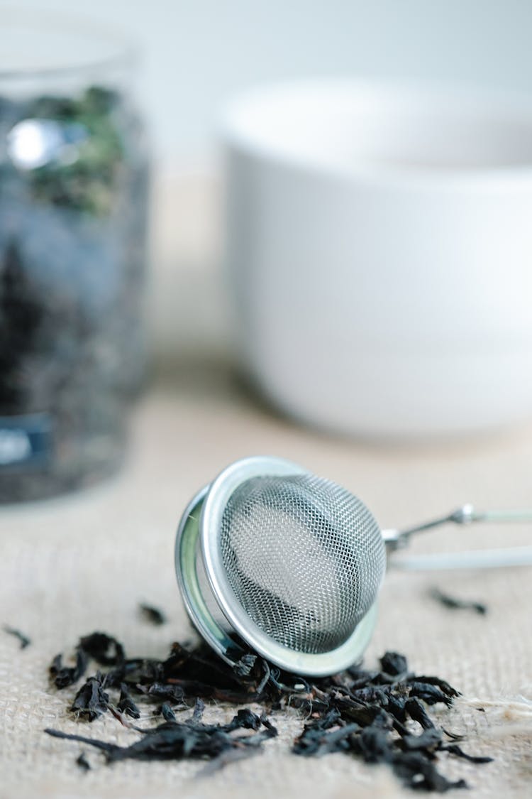 Steel Tea Net And Dry Tea Leaves 