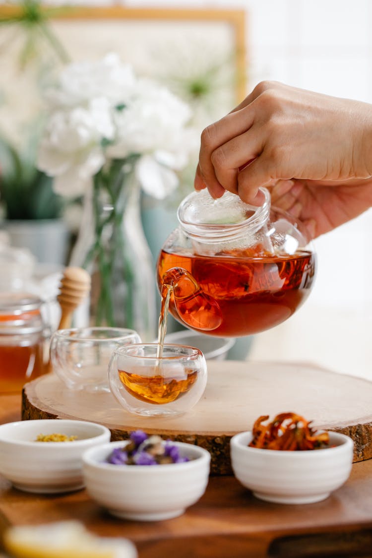 Pouring Tea Into Cup