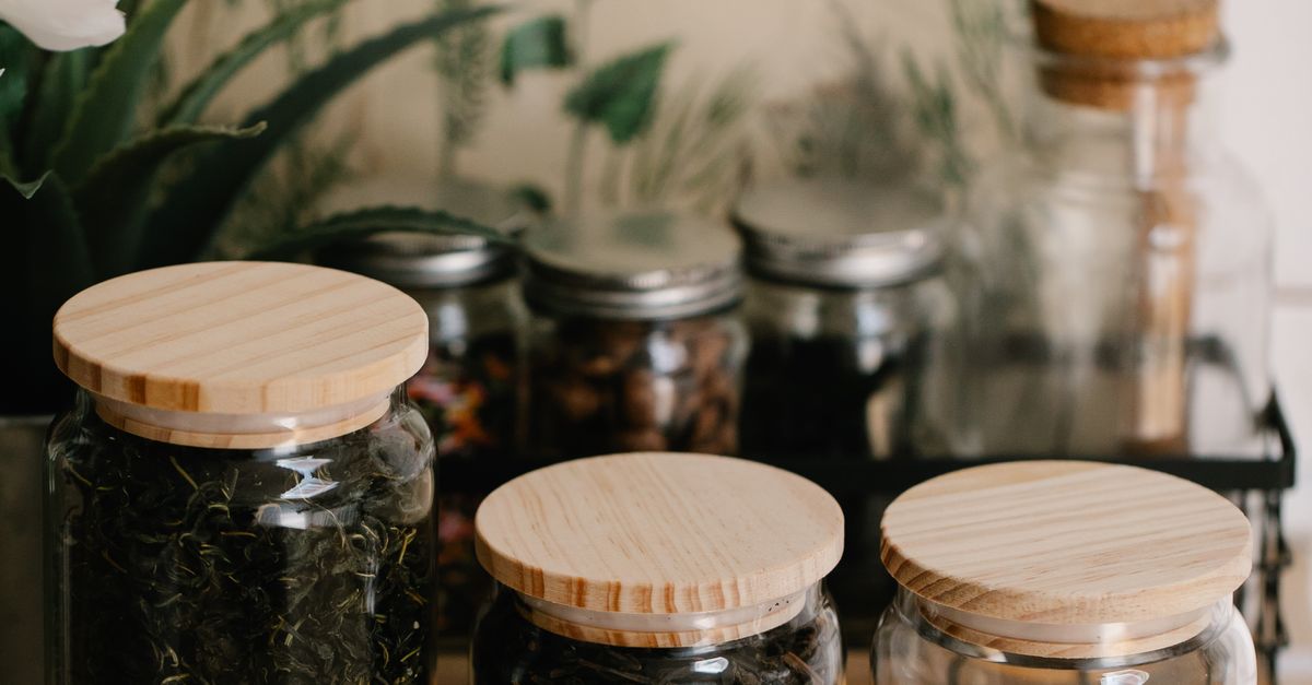 Herbal apothecary jars filled with dried herbs