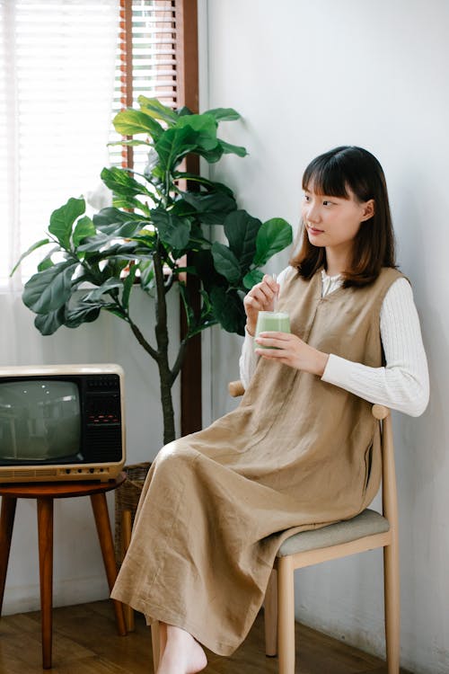 Woman Holding a Drinking Glass