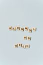 Scrabble Tiles on Light Blue Background