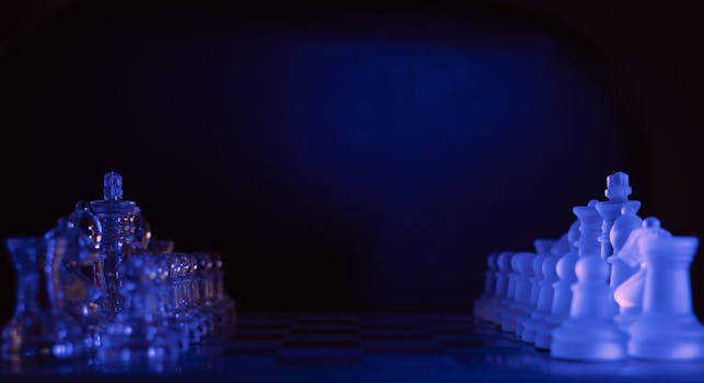 A visually striking close-up of a chessboard with illuminated blue-tinted glass pieces.