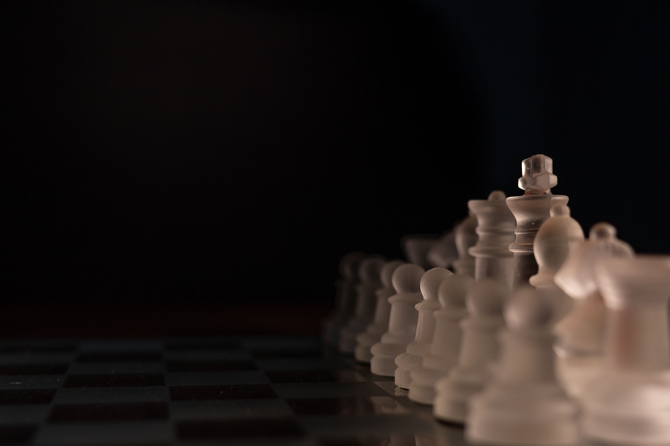 Close Up Shot of Clear Chess Pieces · Free Stock Photo