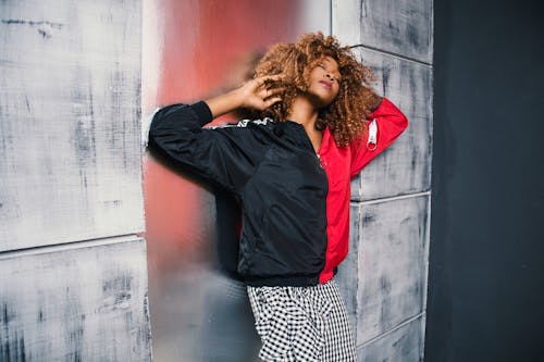 Woman in Red and Black Bomber Jacket