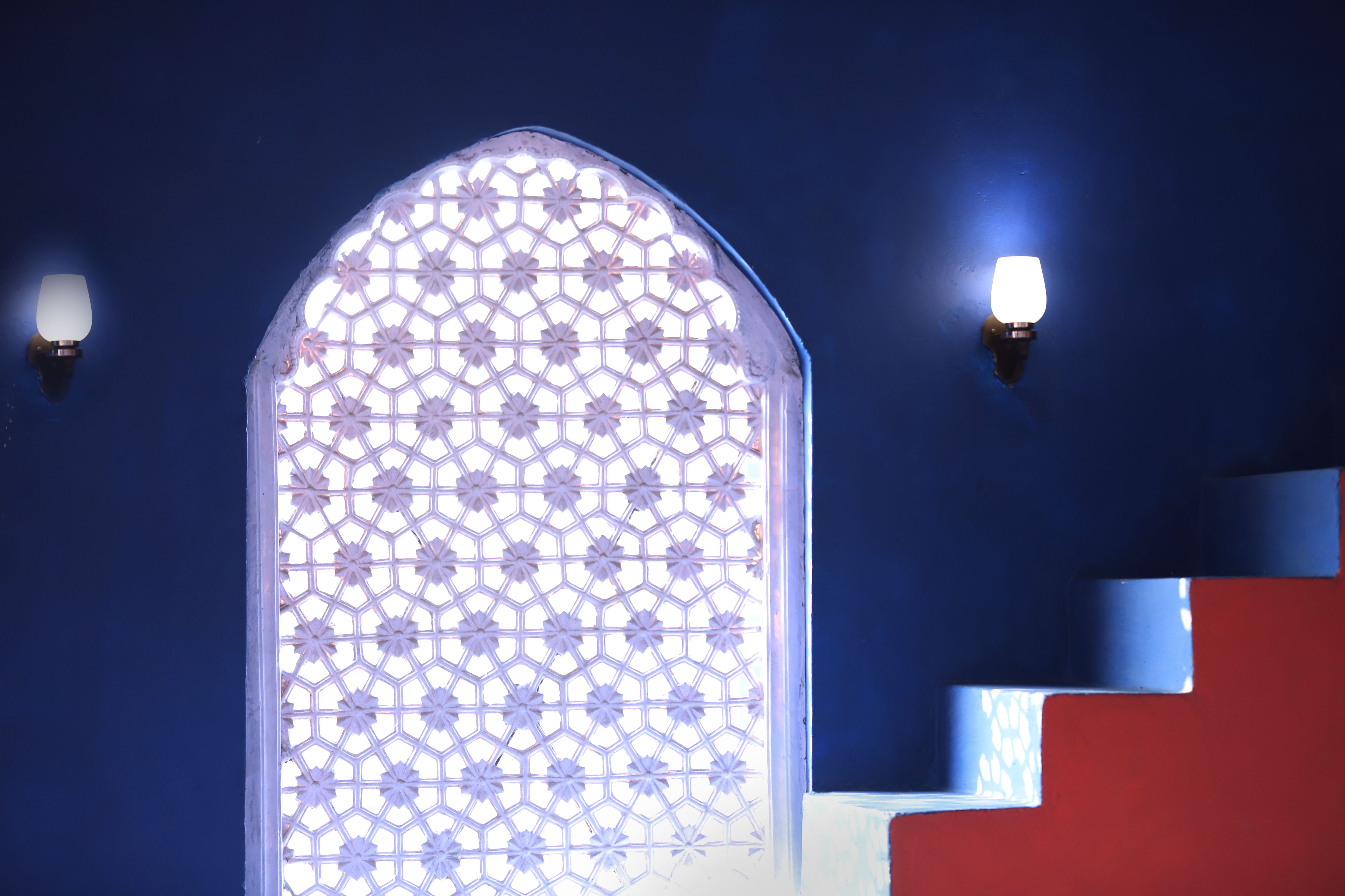 Elegant Indian interior with a decorated lattice window