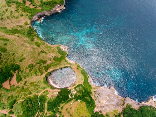 Aerial View of a Lagoon on an Island Near a Body of Water