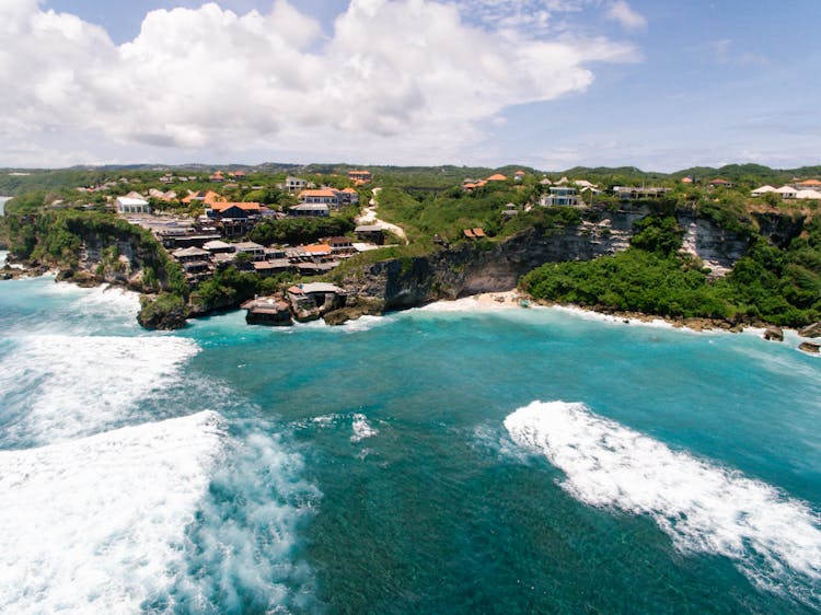 Aerial View Of Ocean Under Cloudy Sky