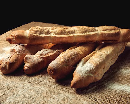 Free Bread on Burlap on a Flat Surface Stock Photo