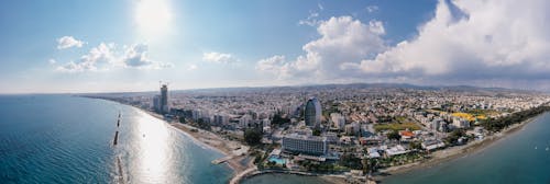 Aerial View of a City With Modern Building Near the Sea