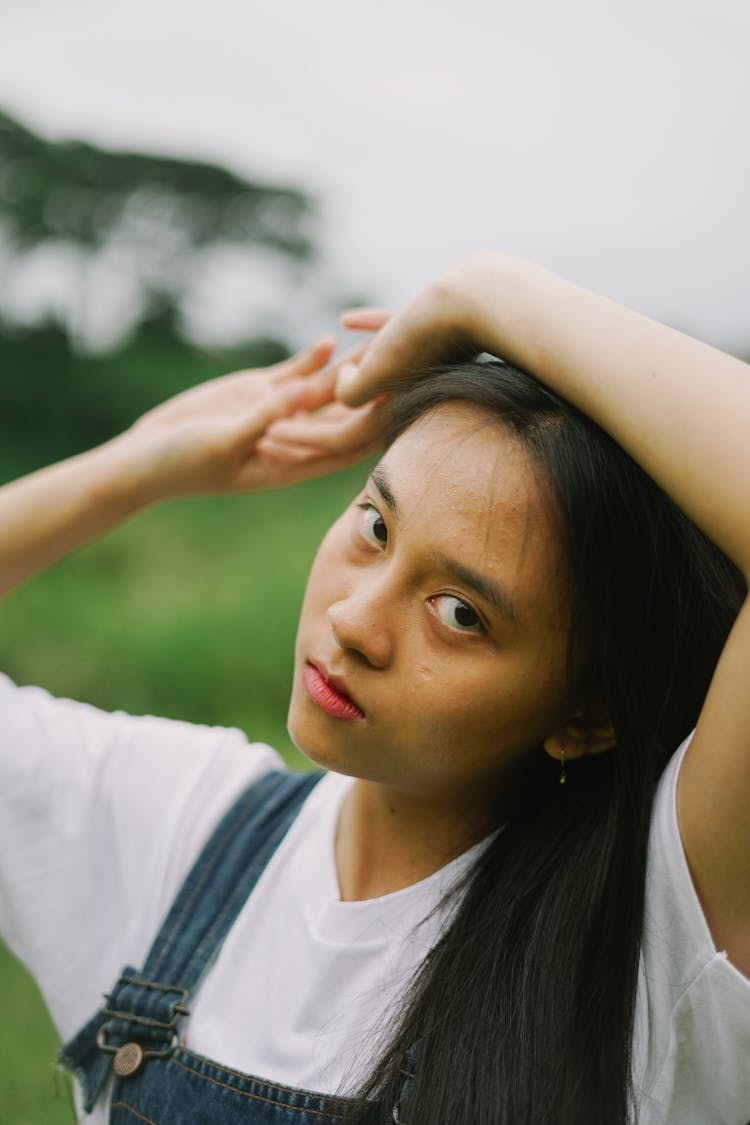 Portrait Of A Young Girl Wearing Overalls 