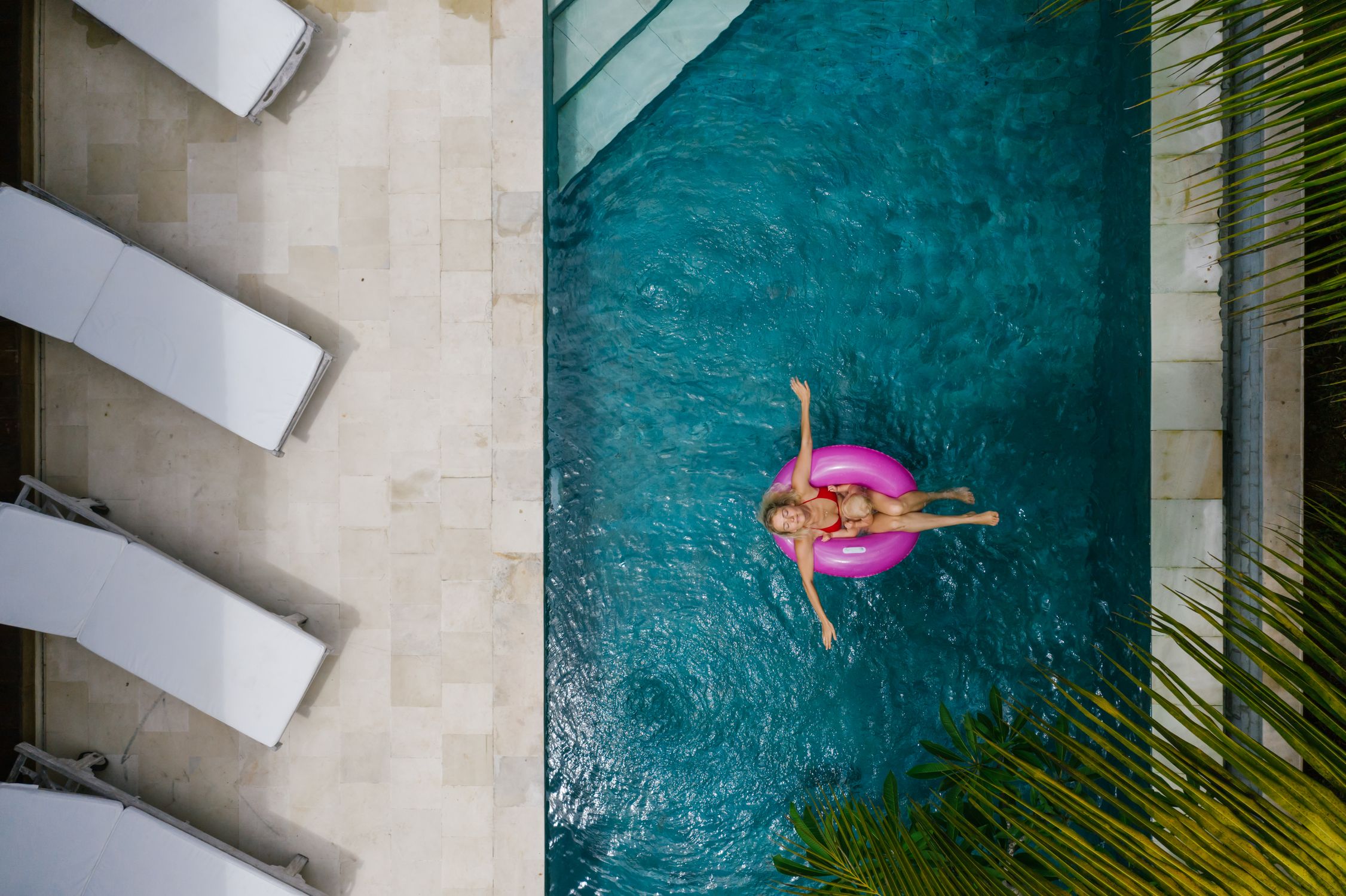 A Woman in Red Bikini Chilling on Pool · Free Stock Photo