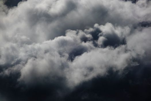 A mesmerizing view of dense, dark clouds capturing the essence of a stormy sky.