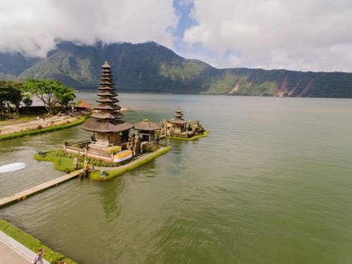 Free A stunning aerial view of Pura Ulun Danu Bratan Temple situated by a serene lake in the highlands of Bali, Indonesia. Stock Photo