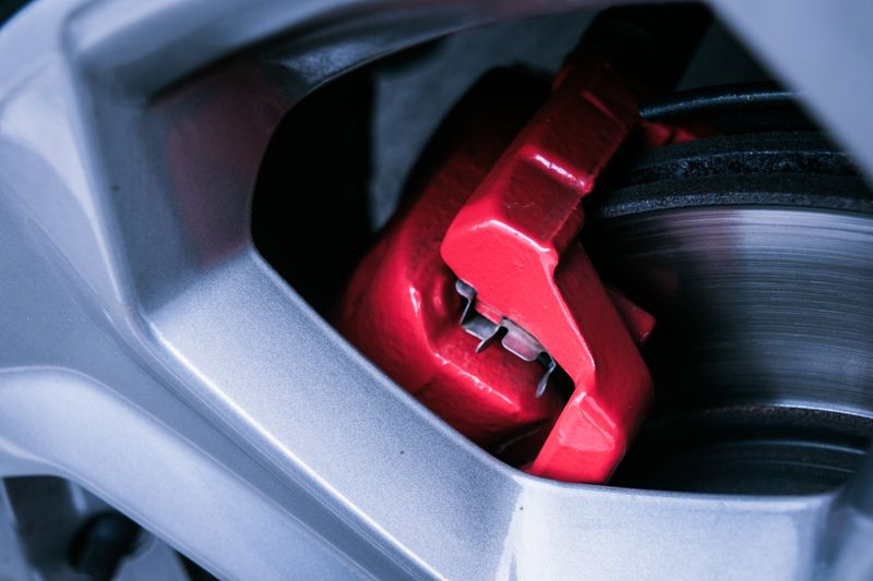 Close-up of a brake rotor and caliper assembly on a modern vehicle wheel