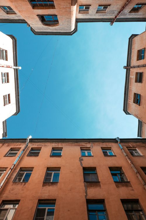 Free Low angle view of historic buildings against a clear blue sky, offering a sense of open space. Stock Photo