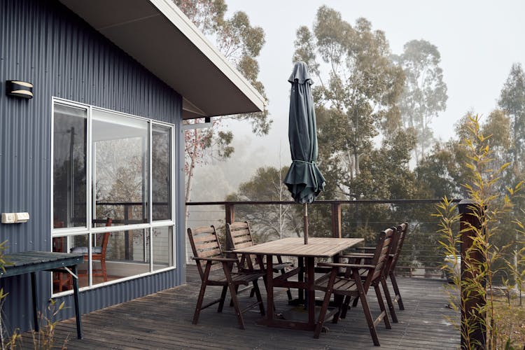 Outdoor Wooden Table Outside House In Nature