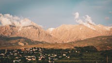 Houses on Lowland Near Mountains