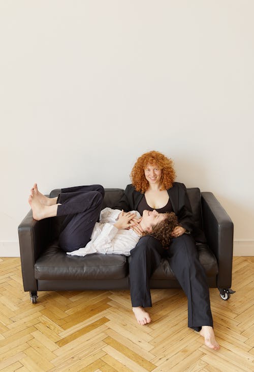 Free A Couple Having Fun on the Couch Stock Photo