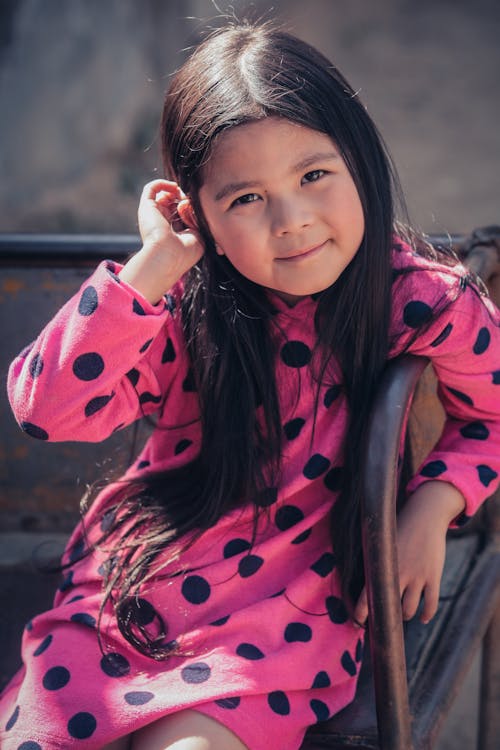 Girl in Pink and Black Polka Dot Long Sleeve Shirt