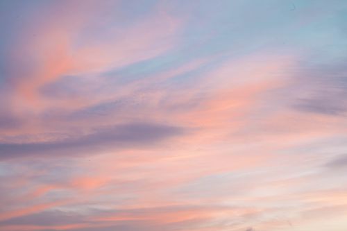 Free Calm sunset sky featuring pink and orange clouds, creating a serene atmosphere. Stock Photo
