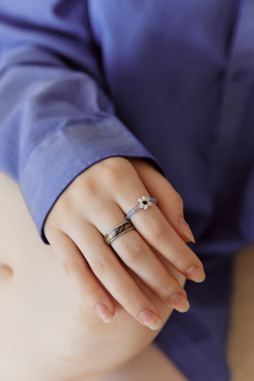 Person Wearing Two Rings