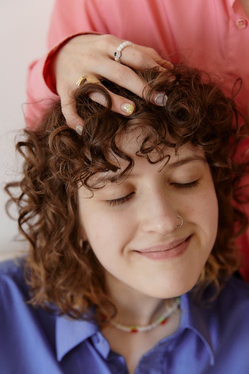 Free Curly Hair Woman With Eyes Closed  Stock Photo
