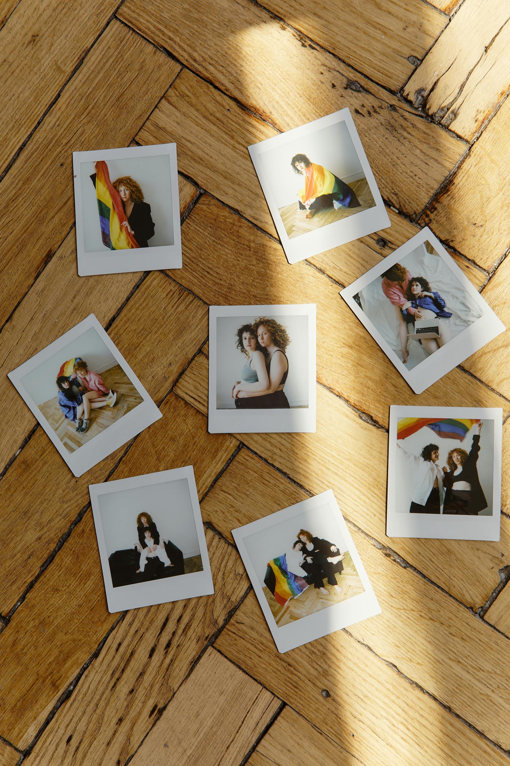 polaroid photos on wooden floor