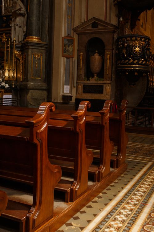 Free Captivating church interior showcasing ornate architecture and empty wooden pews. Stock Photo