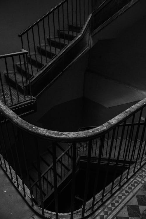 Grayscale Photo of Abandoned Staircase