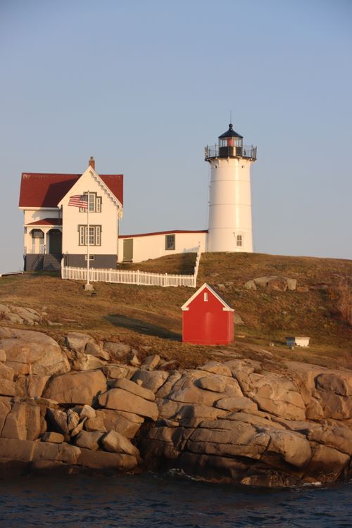 Free Scenic view of Nubble Lighthouse in York, Maine, featuring rocky coastline and iconic architecture. Stock Photo