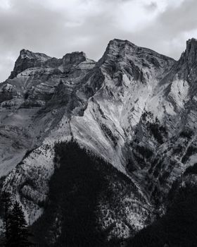 Stunning black and white shot of a rugged mountain peak in Banff, showcasing natural beauty.