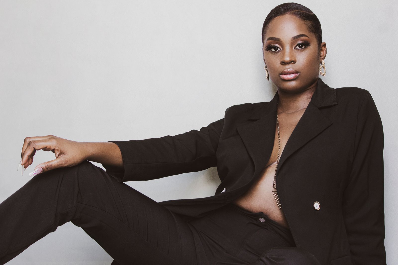 African woman in a black blazer professional portrait