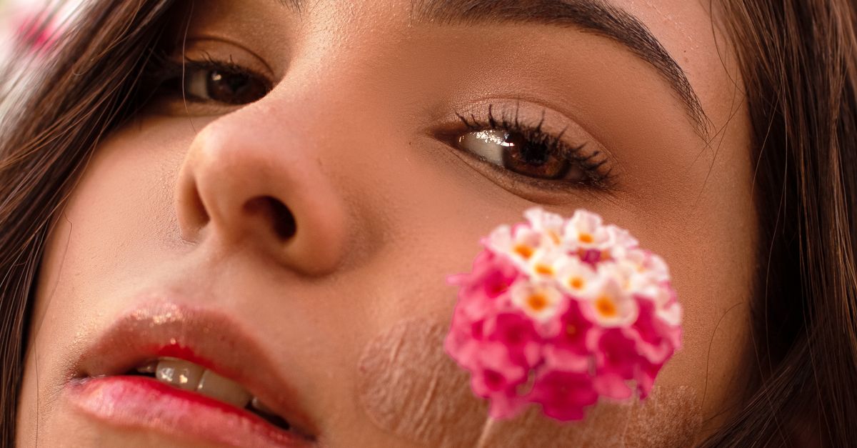 Cheeks Like Roses Woman with flower on cheek · Free Stock Photo