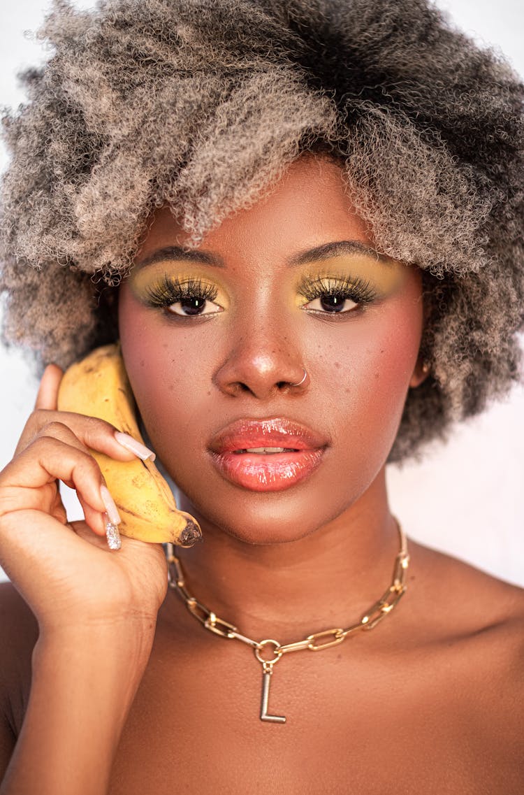 Stylish Black Woman Having Conversation On Banana