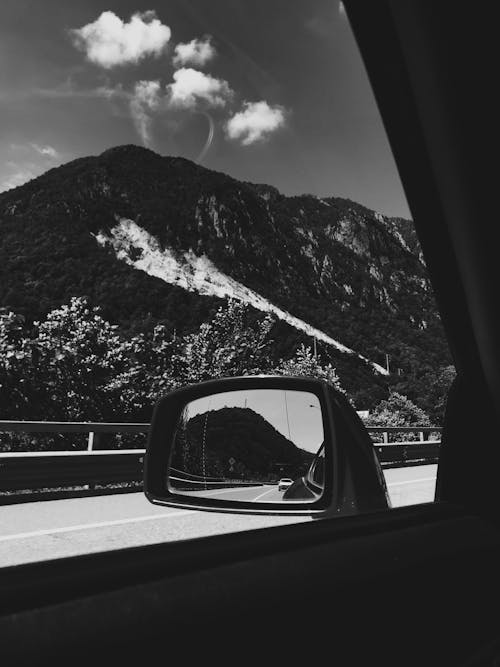Grayscale Photo of Car Side Mirror