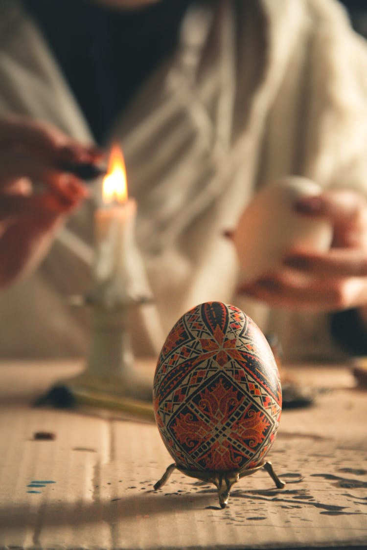 Woman Painting Traditional Decoration On Eggs