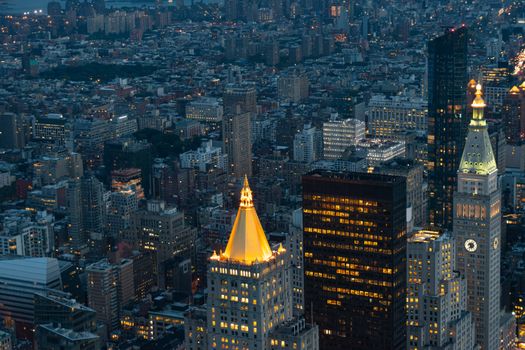 Stunning aerial view of New York City skyscrapers illuminated at night.