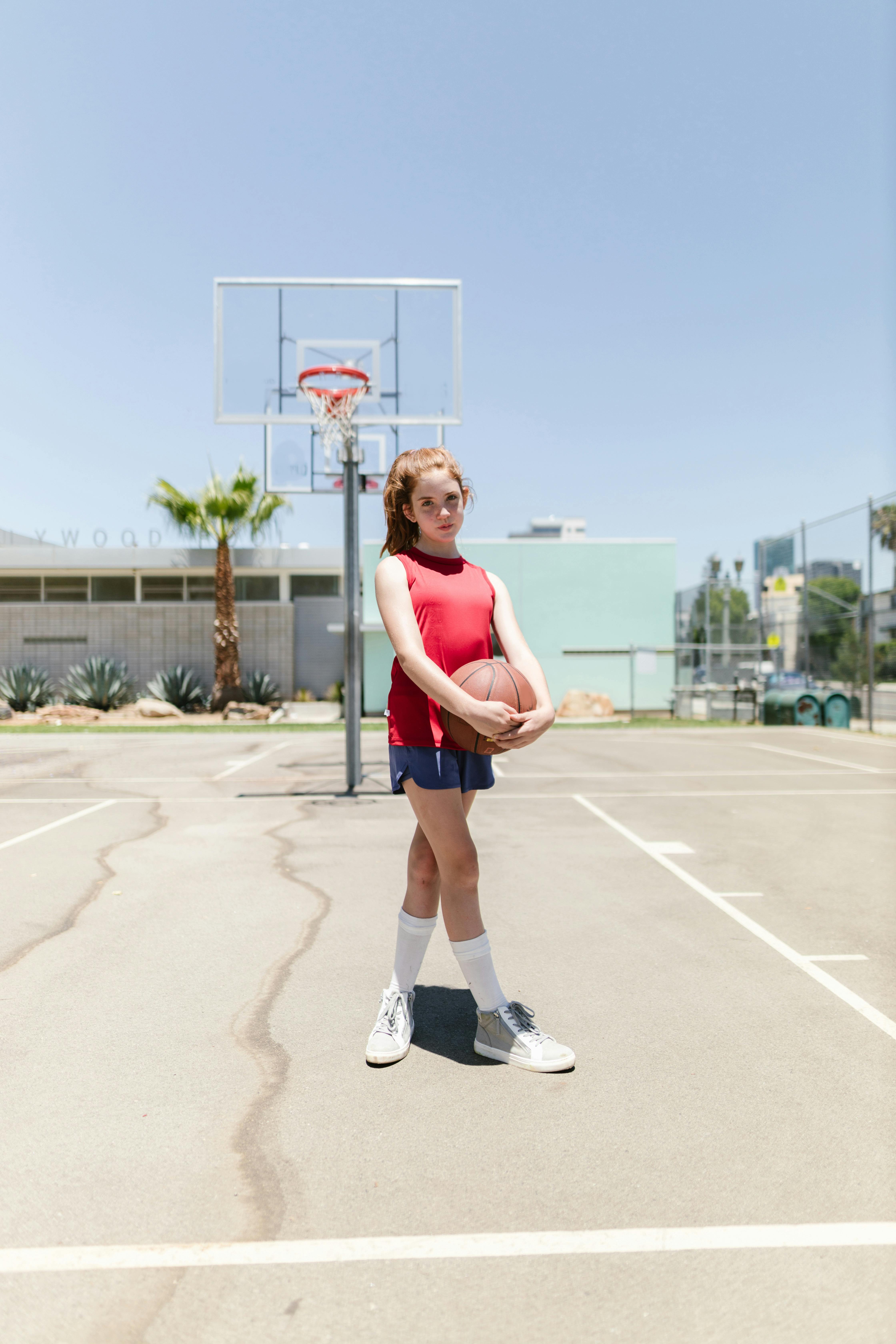 girl holding basketball