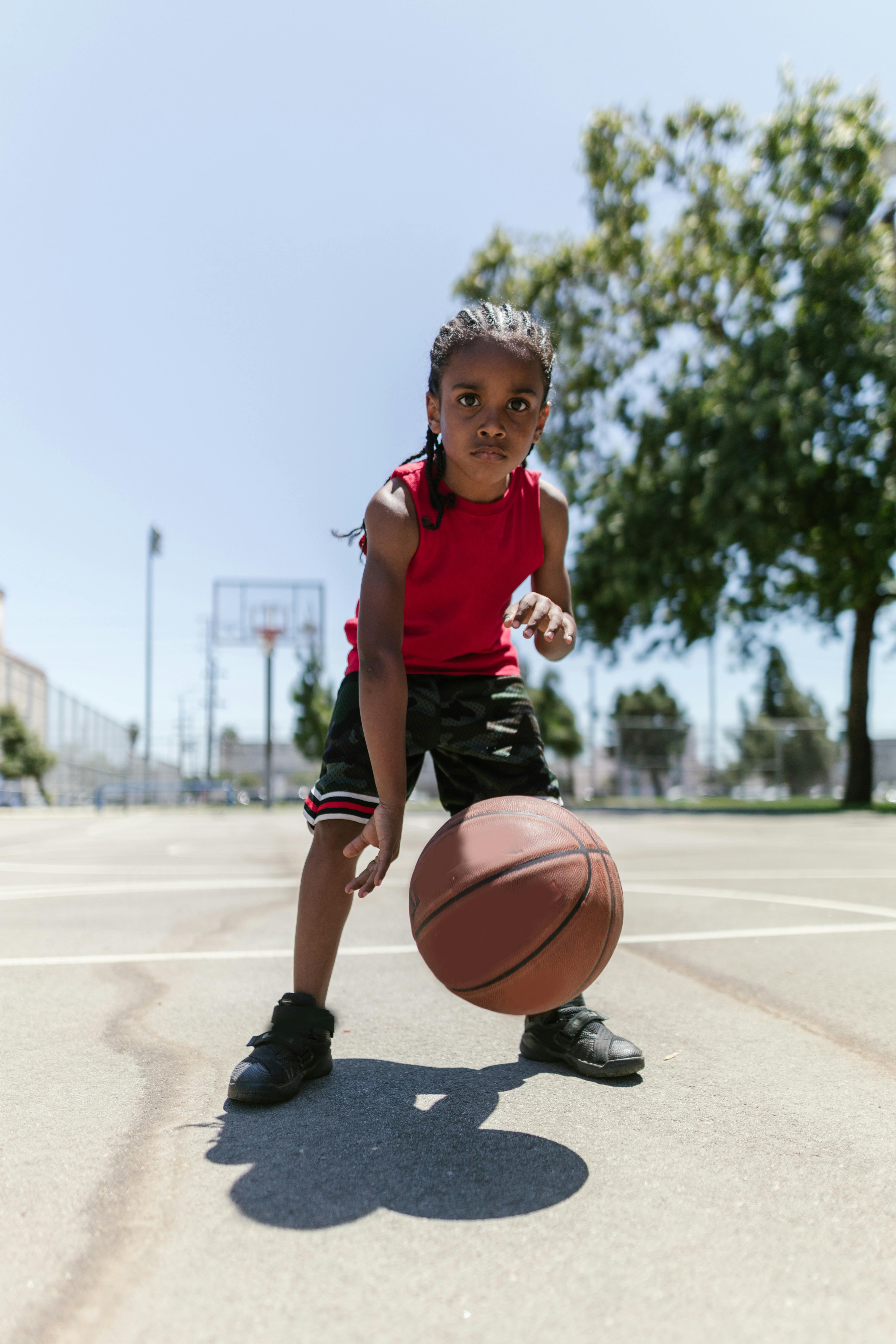 black kid playing basketball