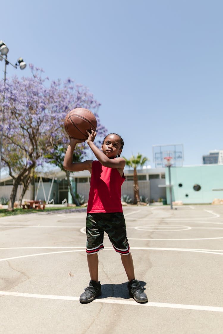 Boy Holding A Basketball