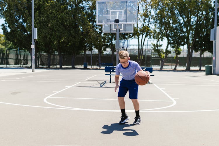 A Boy Playing Basketball 